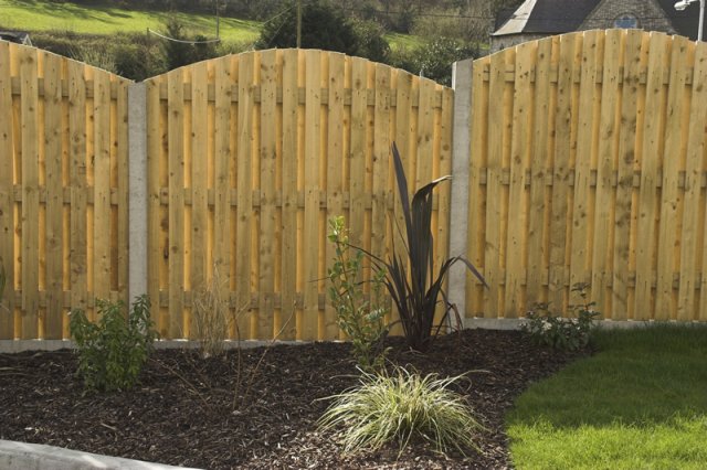 Arched Hit & Miss panels in Concrete Posts and with Gravel Boards